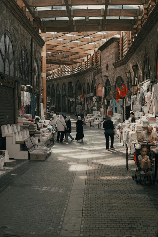 a group of people walking through a market, pexels contest winner, renaissance, books all over the place, turkey, inspect in inventory image, empty streetscapes