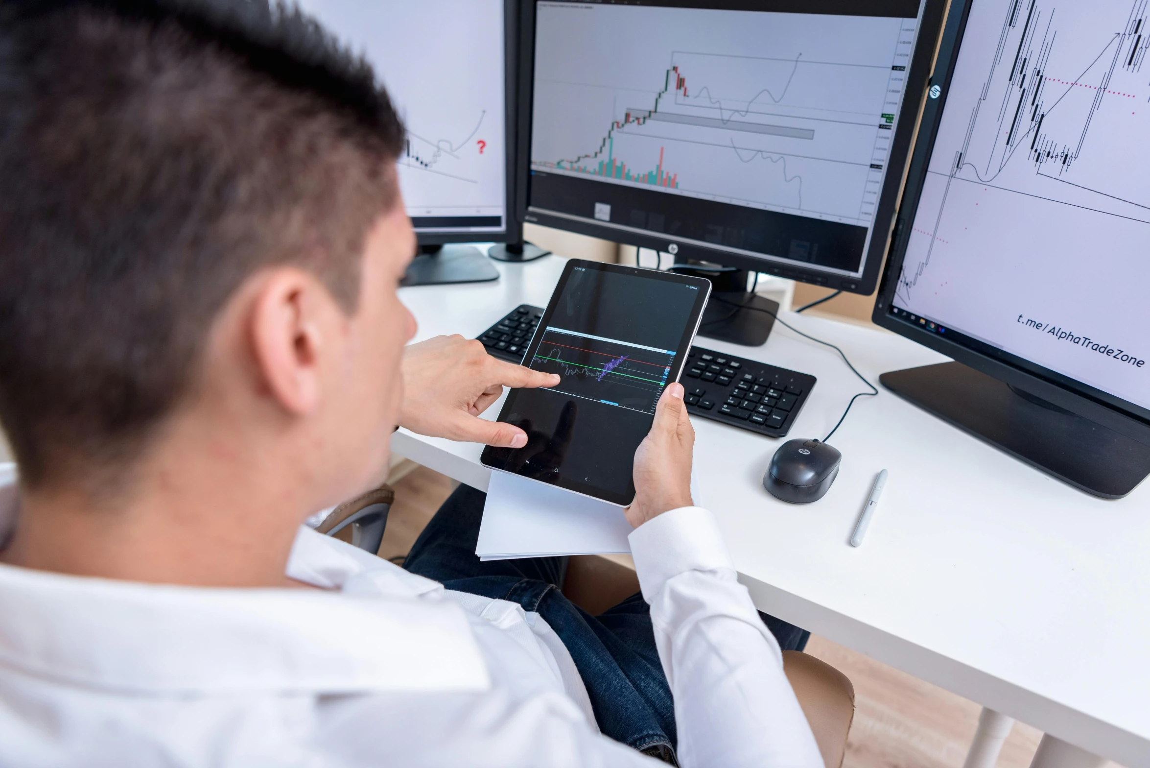 a man sitting at a desk using a tablet computer, analytical art, trading stocks, qirex, instagram photo, thumbnail