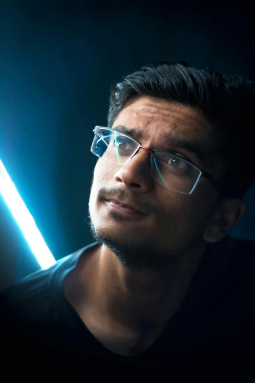 a close up of a person wearing glasses, inspired by Bikash Bhattacharjee, light and space, lightsaber, male model, light mode, multiple stories