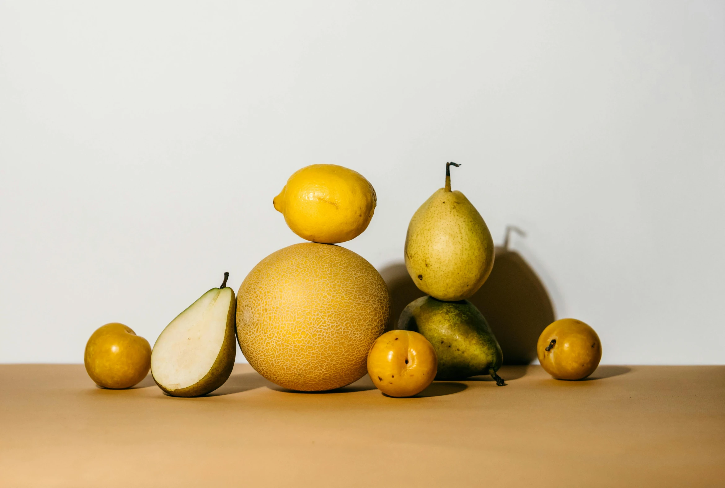 a pile of fruit sitting on top of a table, light yellow, product image, pear, full-figure