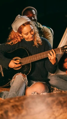 a group of people sitting around a campfire playing guitar, pexels contest winner, renaissance, photo of young woman, juno promotional image, multi-part, super high resolution