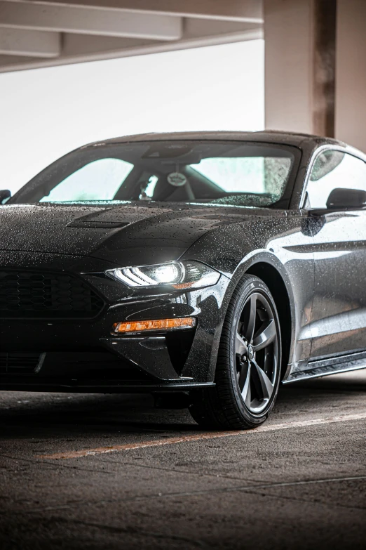 a black mustang parked in a parking garage, in 2 0 1 8, thumbnail, may), features