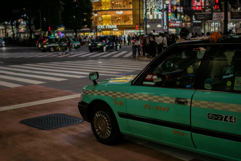 a taxi cab on a busy city street at night, by Carey Morris, pexels contest winner, ukiyo-e, square, green glow, 80's japanese photo, 🚿🗝📝