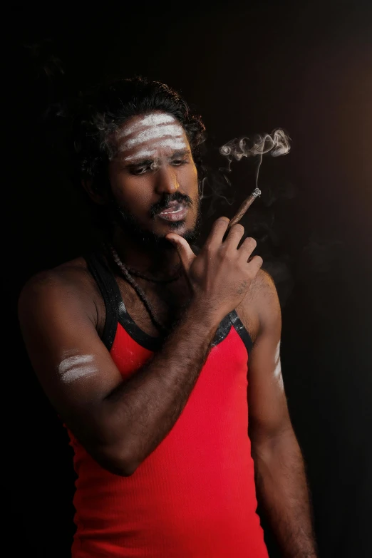 a man in a red tank top smoking a cigarette, an album cover, inspired by Kailash Chandra Meher, pexels contest winner, aboriginal australian hipster, deity), studio photo, man is with black skin