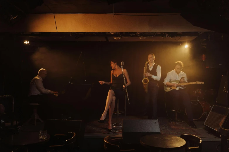 a group of people standing on top of a stage, a portrait, unsplash, figuration libre, 1 9 3 0 s jazz club, smokey room, 15081959 21121991 01012000 4k, thumbnail