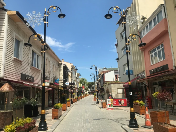 a city street filled with lots of tall buildings, art nouveau, turkey, gas street lamps. country road, baris yesilbas, photo taken in 2 0 2 0