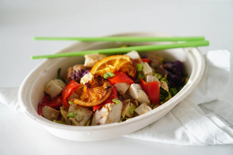 a close up of a bowl of food with chopsticks, profile image, square, with a white background, salad