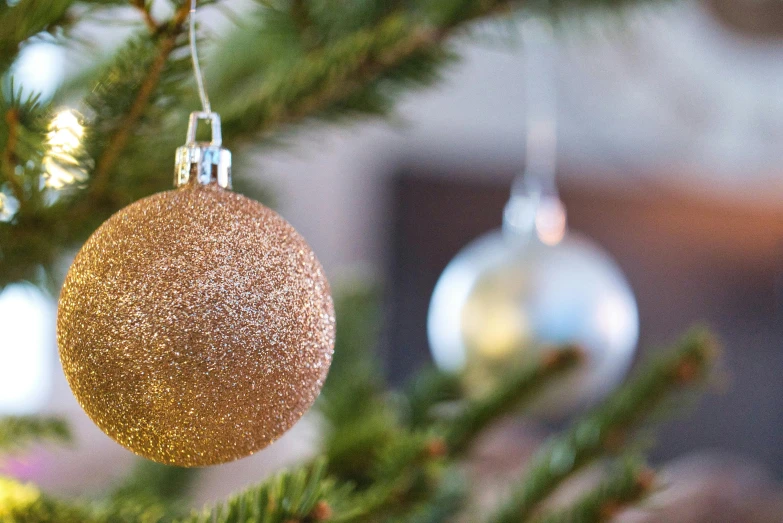 a close up of a christmas ornament on a tree, pexels, golden orbs, cosy enchanted scene, hdri lighting, laura watson