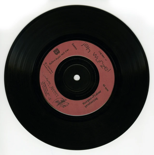 a black record sitting on top of a white surface, by Jay Hambidge, label, sigman 85mm, cut-away, 1 st winner