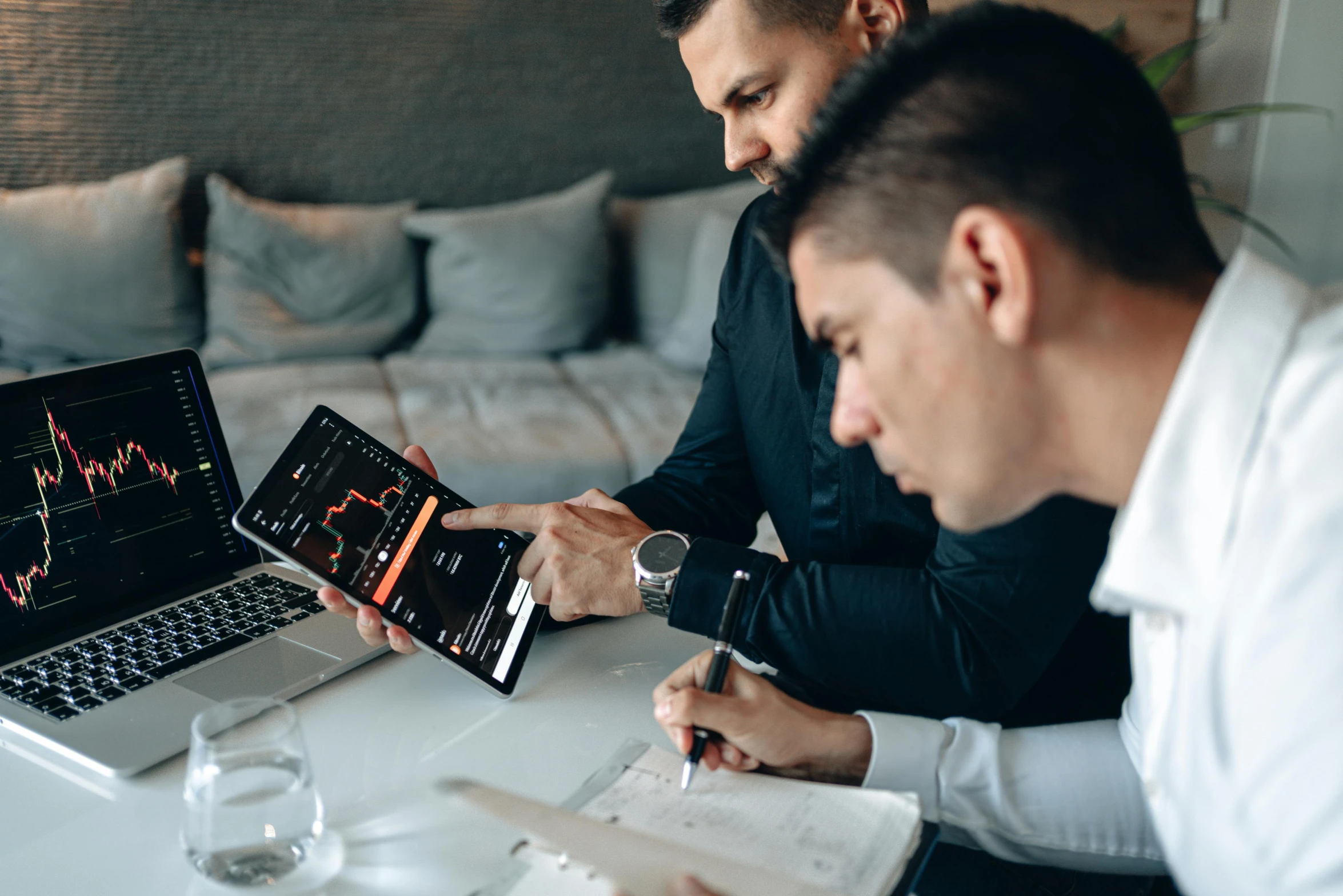 a couple of men sitting at a table with laptops, a screenshot, by Sebastian Vrancx, pexels contest winner, charts, exponential, thumbnail, digital asset