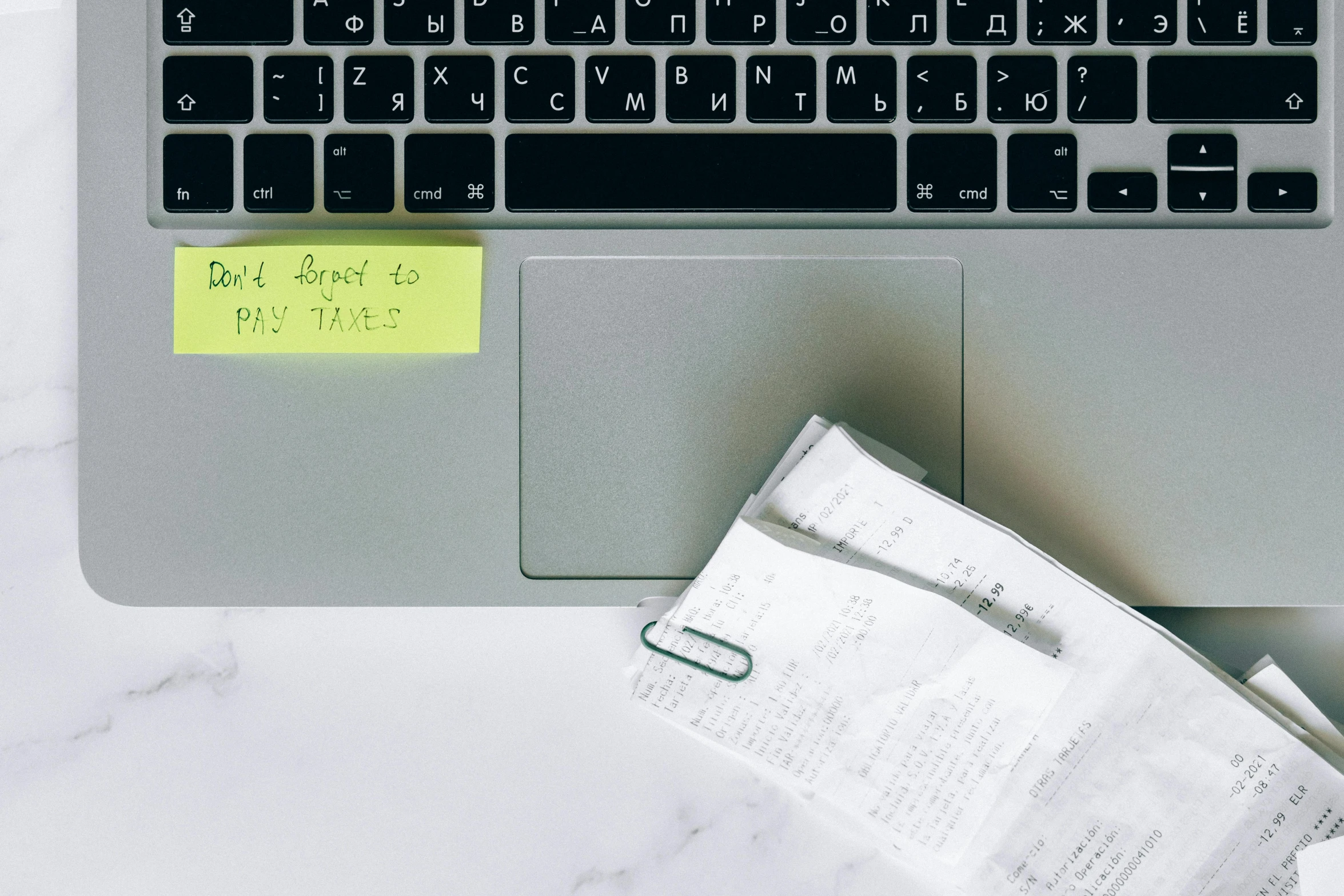 a laptop computer sitting on top of a desk, by Adam Rex, trending on pexels, ink on post it note, all marble, green neon details, service ticket close up