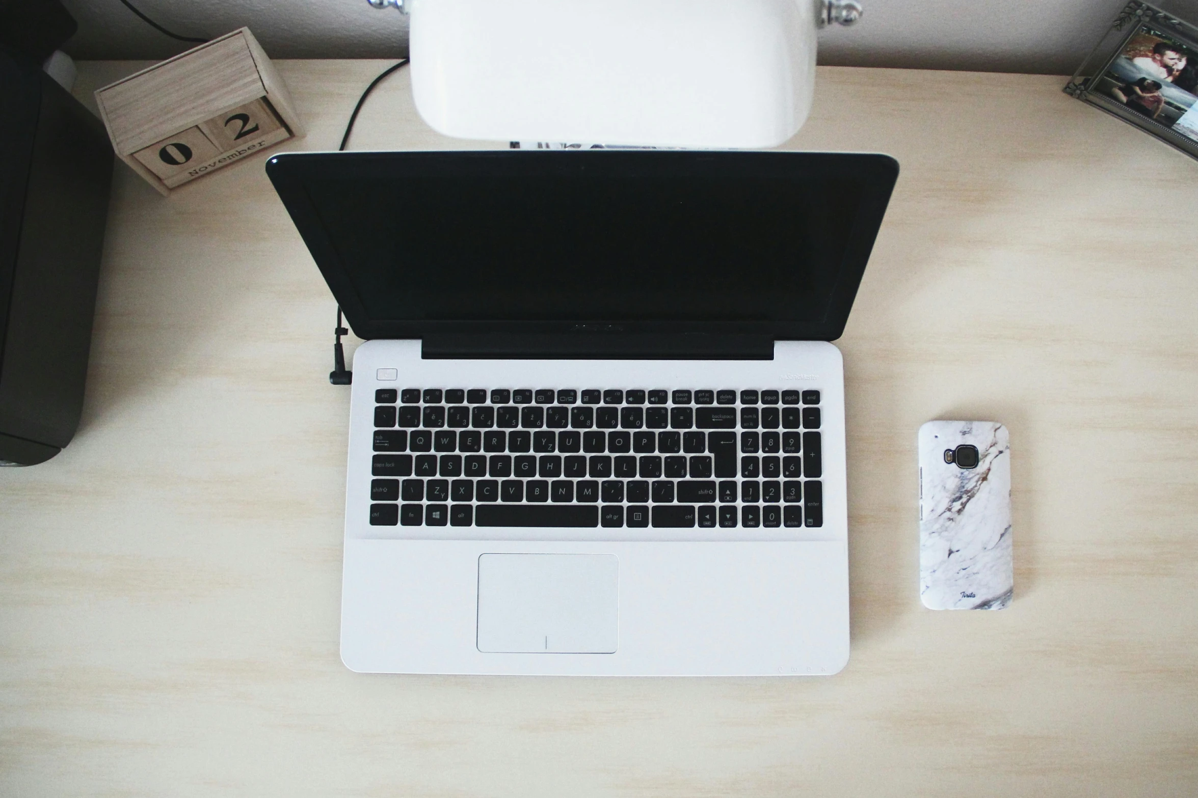 a laptop computer sitting on top of a wooden desk, unsplash, 9 9 designs, white, overview, computer desk