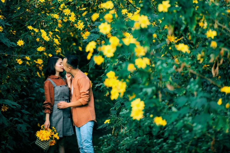 a couple kissing in a field of yellow flowers, pexels contest winner, in a jungle environment, hoang long ly, profile image, vine and plants and flowers