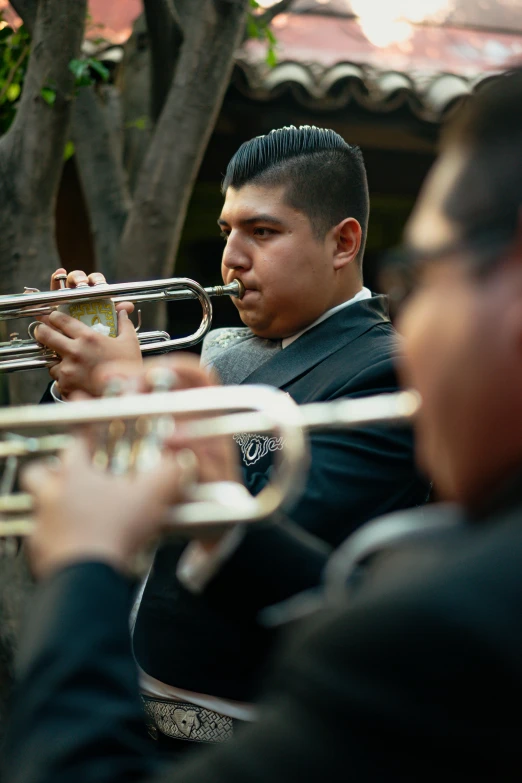 a man in a suit playing a trumpet, an album cover, by Alejandro Obregón, pexels contest winner, lined up horizontally, tlaquepaque, b - roll, performing