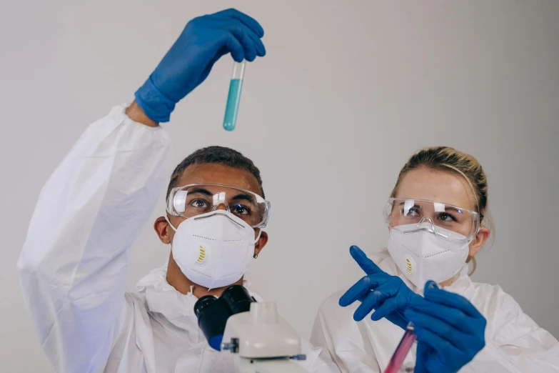 two people in lab coats holding up a test tube, pexels contest winner, respirator, gif, painters, white