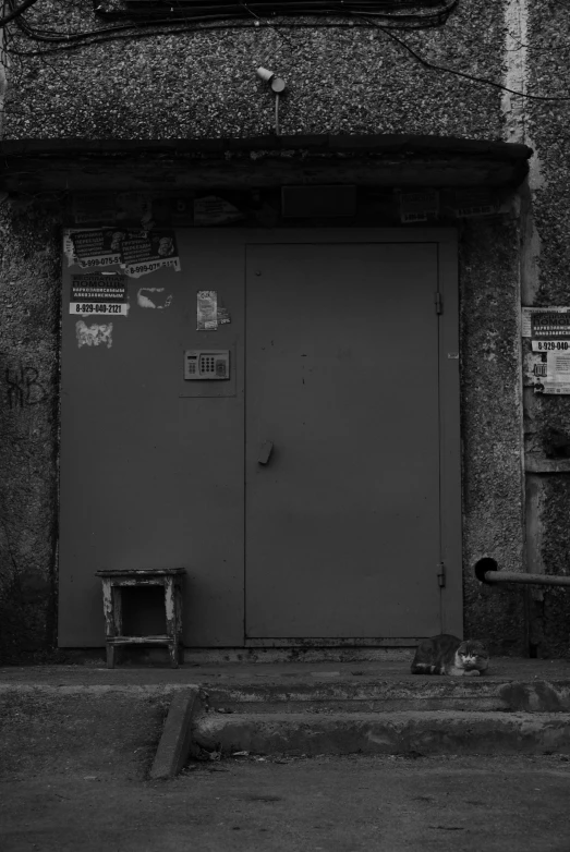 a black and white photo of a building, a black and white photo, by Ei-Q, a door you must never open, dusty abandoned shinjuku, no type, small manufacture