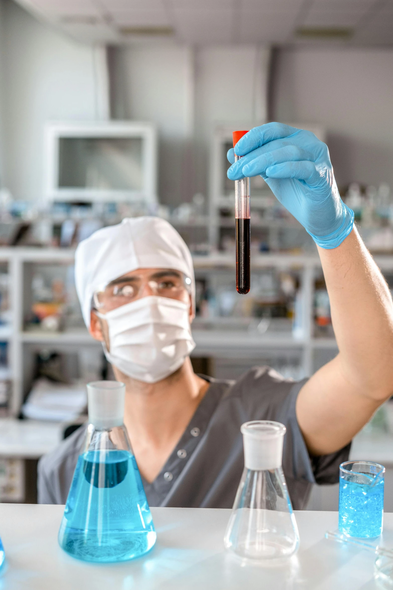 a man in a lab holding a test tube, a picture, shutterstock, renaissance, neoprene, brown, masked doctors, instagram photo