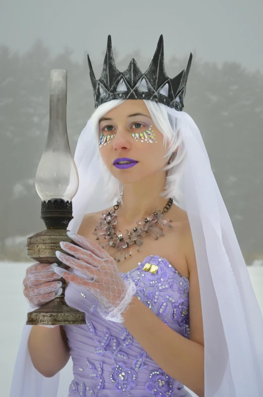 a woman dressed as a snow queen holding a lamp, inspired by Limbourg brothers, dark purple crown, princess zelda, clear as crystal, the non-binary deity of spring