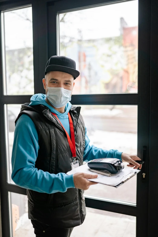 a man standing in front of a window with a mask on, a picture, delivering mail, holding a clipboard, very detailed », healthcare