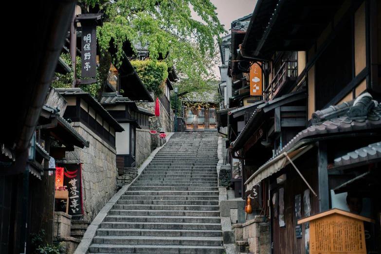 a set of stairs going up the side of a building, inspired by Tōshi Yoshida, pexels contest winner, mingei, quaint village, shrines, thumbnail, grey