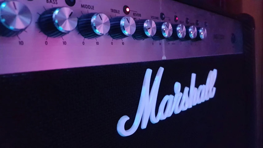 a close up of a guitar amplifier in a room, by Marshall Arisman, massurrealism, fuschia leds, instagram picture, marshmallow, show from below