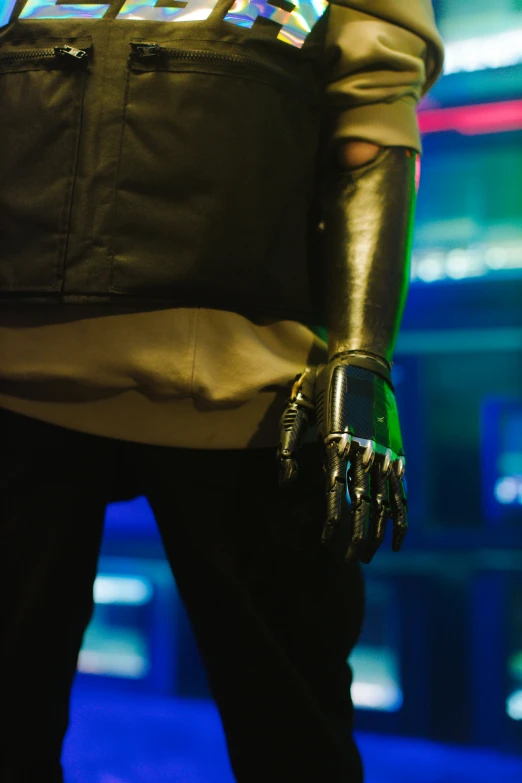 a close up of a person wearing a jacket and gloves, cyberpunk art, unsplash, prosthetic limbs, in a nightclub, promo image, prosthetic arm