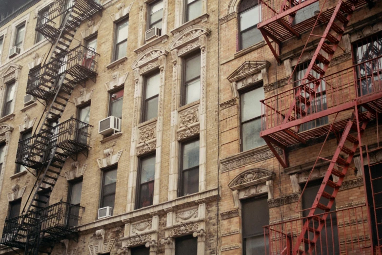 a row of fire escapes on the side of a building, by Nina Hamnett, dressed in ornate, photograph, 2000s photo