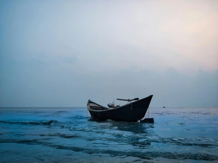 a boat floating on top of a body of water, by Carey Morris, pexels contest winner, assamese aesthetic, cold hues, black sea, slide show