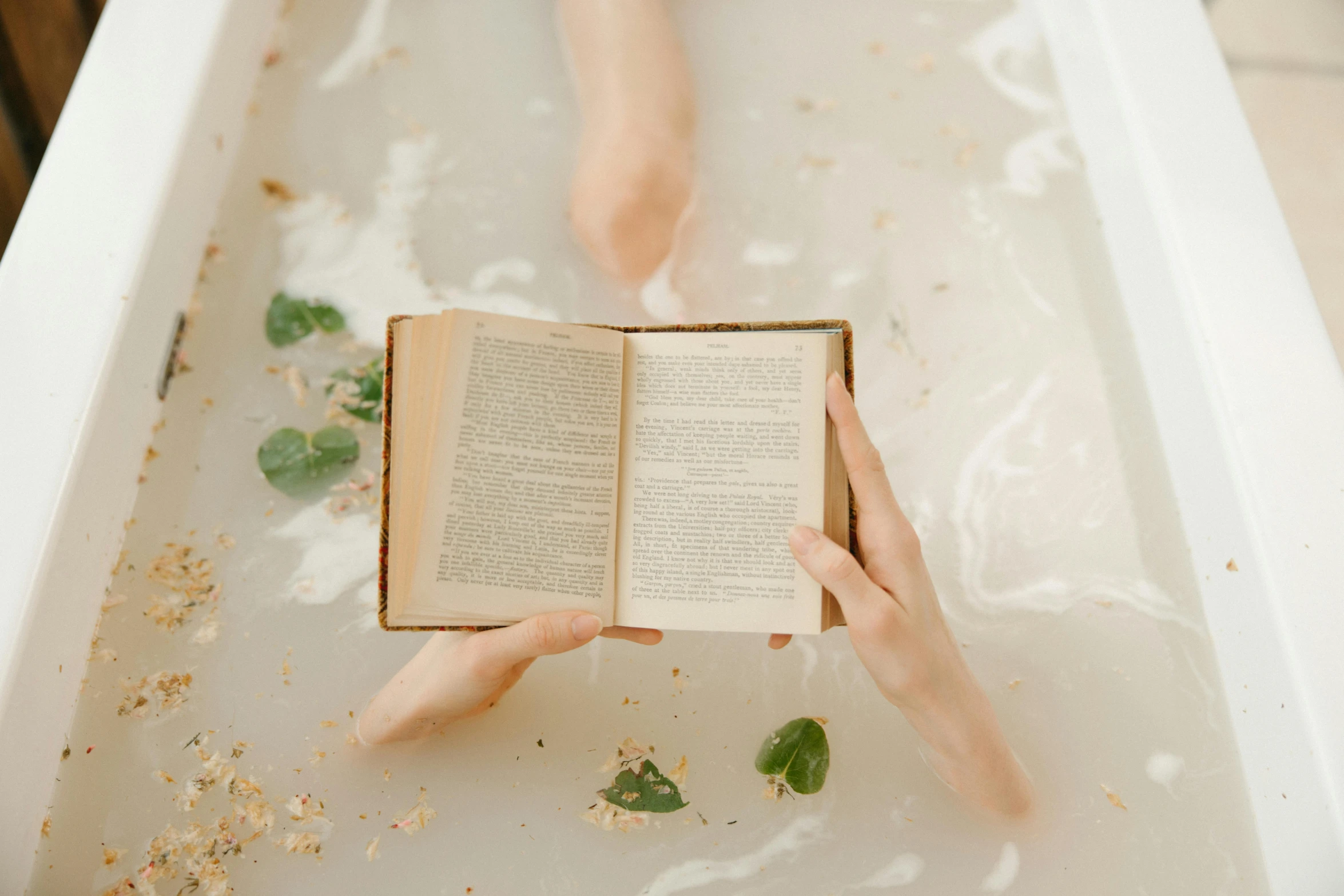 a person reading a book in a bathtub, pexels contest winner, renaissance, made purely out of water, on a pale background, paddle of water, wet body