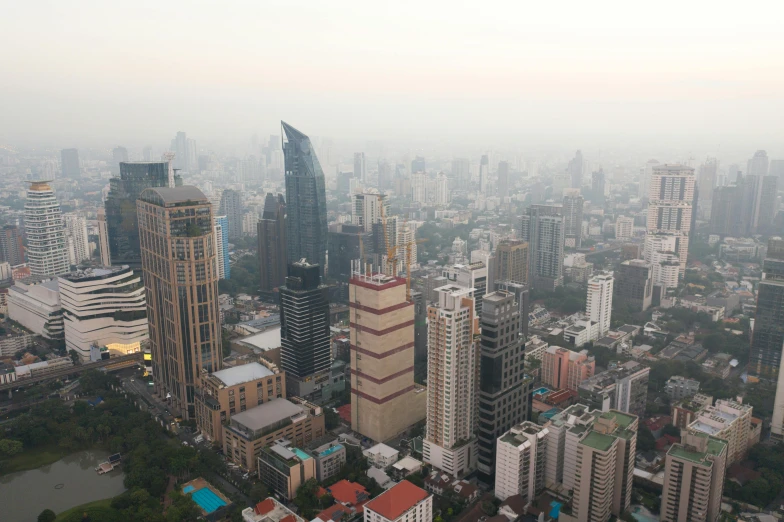 a view of a city from the top of a building, pexels contest winner, ground haze, bangkok townsquare, rem koolhaas, aerial