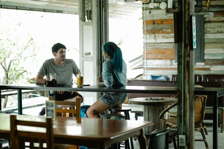a couple of people that are sitting at a table, by Lee Loughridge, unsplash, happening, straya, quaint, still from riverdale, full body image