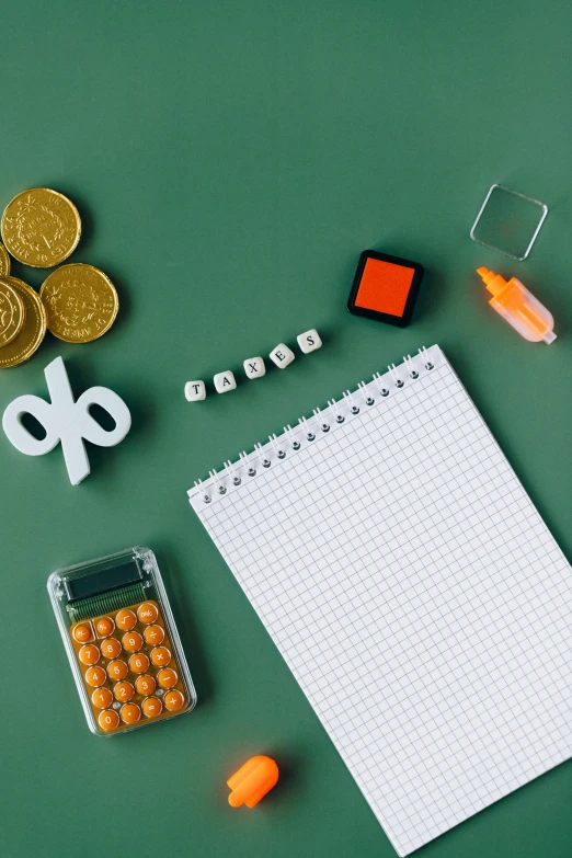 a notepad sitting on top of a desk next to a calculator, floating objects, thumbnail, toys, student
