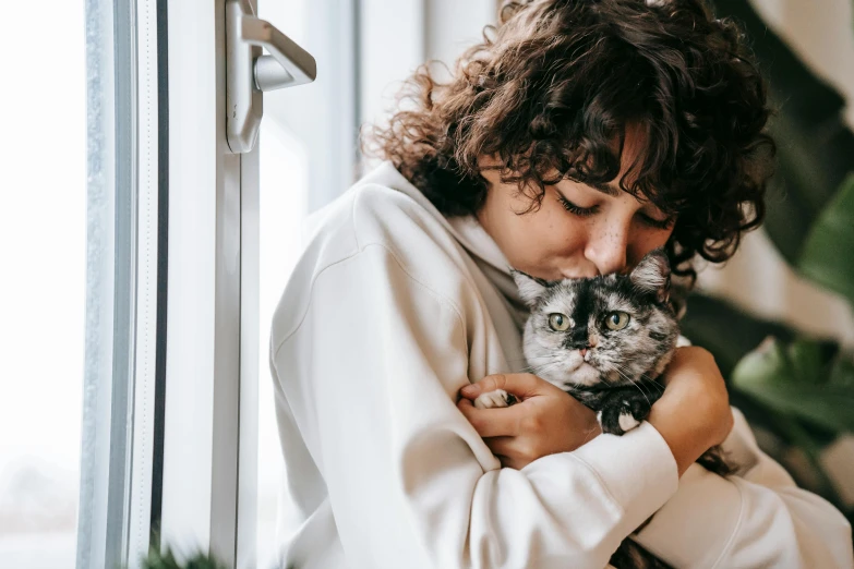 a woman holding a cat in her arms, trending on pexels, rebecca sugar, domestic, hugging each other, thoughtful expression