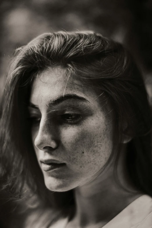 a black and white photo of a woman with freckles, pexels contest winner, renaissance, young woman in her 20s, wistful expression, girl with brown hair, a close up shot