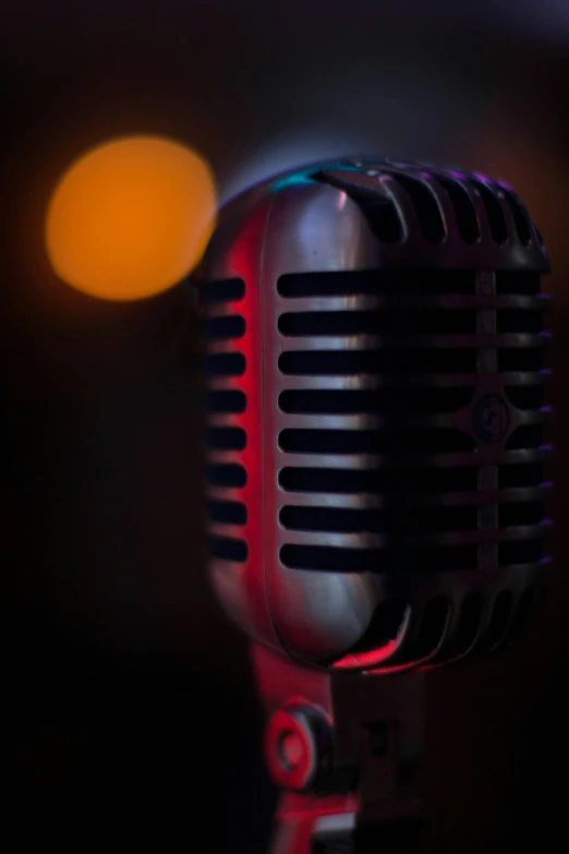 a close up of a microphone with a blurry background, by Dave Melvin, pop art, shot at night with studio lights, no - text no - logo, digital image, instagram photo