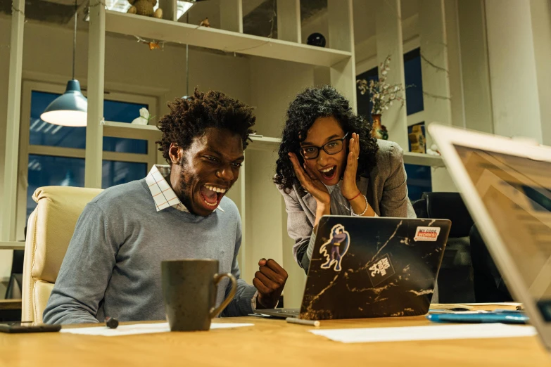 a couple of people sitting at a table with a laptop, pexels contest winner, happening, screaming, afro tech, avatar image, in an office