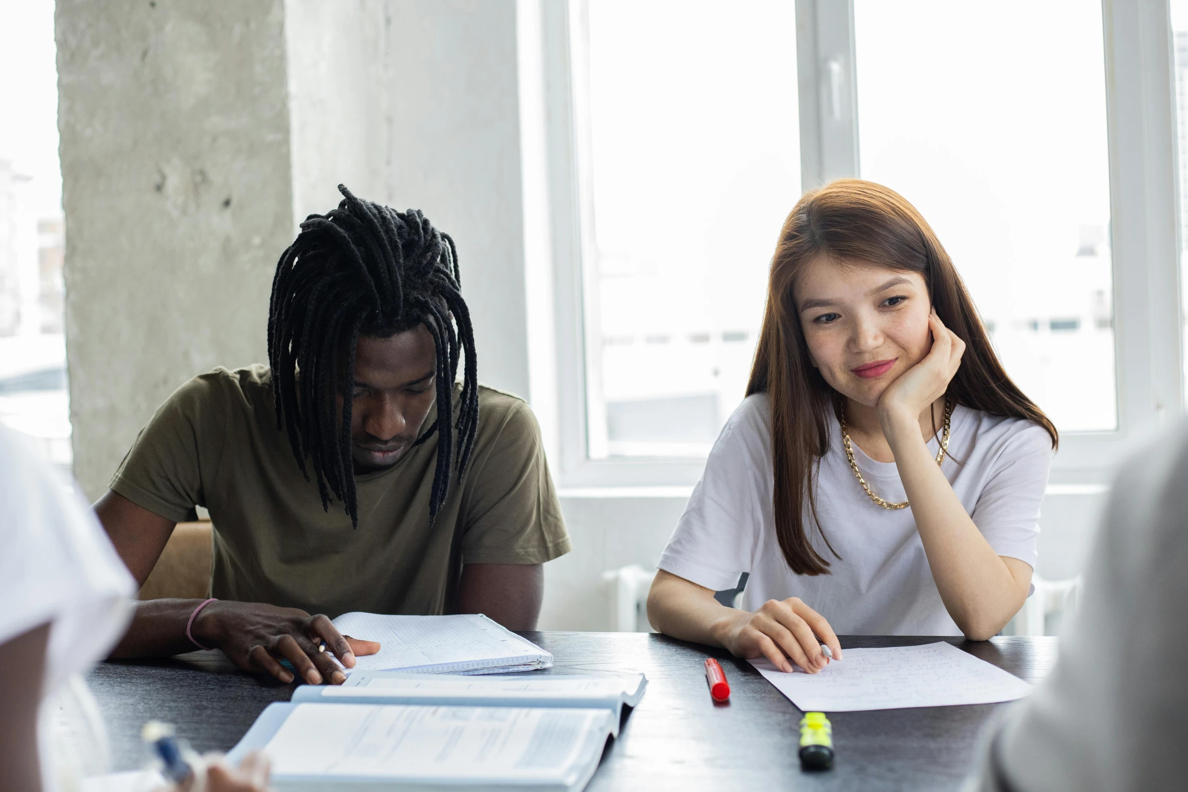 a group of people sitting around a table, pexels contest winner, academic art, background image, two people, varying ethnicities, boy and girl are the focus