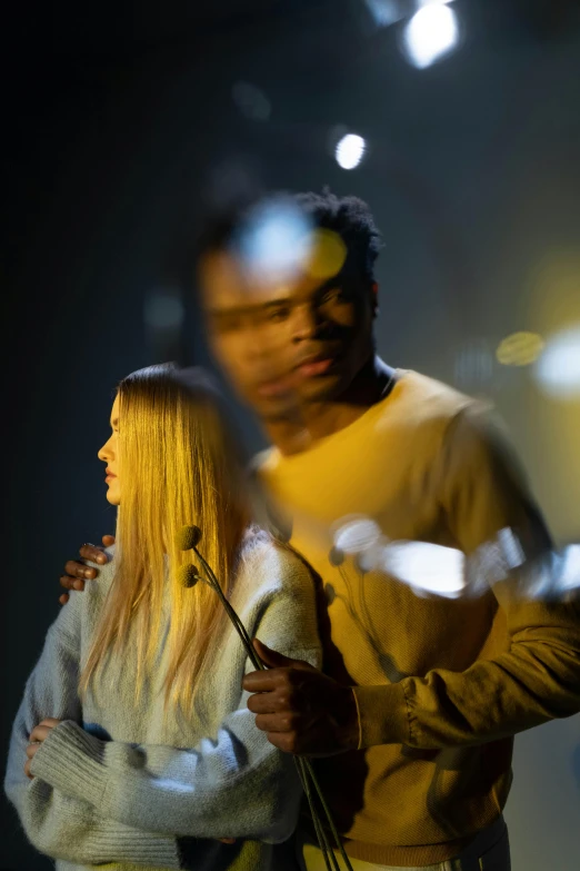 a man and a woman standing next to each other, a hologram, pexels contest winner, realism, focus on the musicians, ( ( theatrical ) ), hair light, scene from church