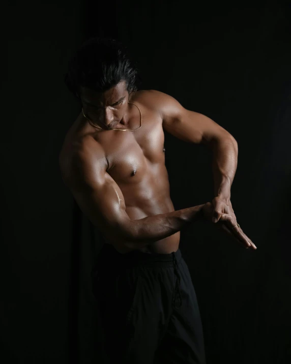 a man that is standing in the dark, by Cosmo Alexander, pexels contest winner, renaissance, flexing large muscles, asian male, profile image, white skirt and barechest