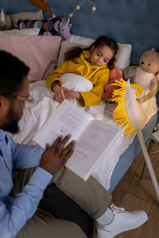 a man reading a book to a little girl in a bed, inspired by Maurice Sendak, pexels contest winner, with a robotic arm, hospital room, diverse, product introduction photo