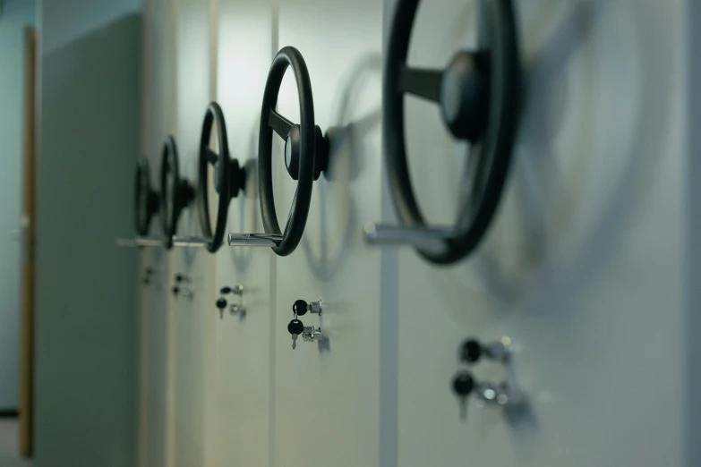 a row of lockers lined up against a wall, unsplash, private press, cart wheels, closeup of arms, scientific equipment, profile image