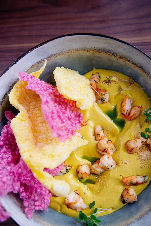 a bowl of food sitting on top of a wooden table, renaissance, pink and yellow, mexico city, shrimp, fuschia skin