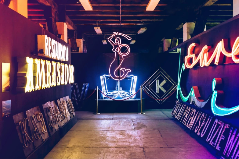 a room filled with lots of neon signs, an album cover, unsplash contest winner, kinetic art, in a warehouse, head to waist, phosphorescent, kenny scharf