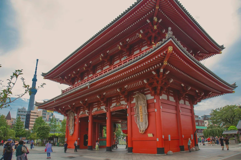 a group of people standing in front of a red building, inspired by Kanō Hōgai, pexels contest winner, huge gate, square, monumental structures, jdm