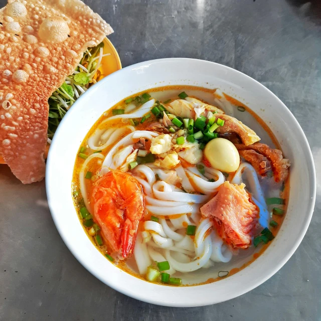 a bowl of soup and a sandwich on a table, inspired by Tan Ting-pho, pexels contest winner, prawn, square, ao dai, noodles