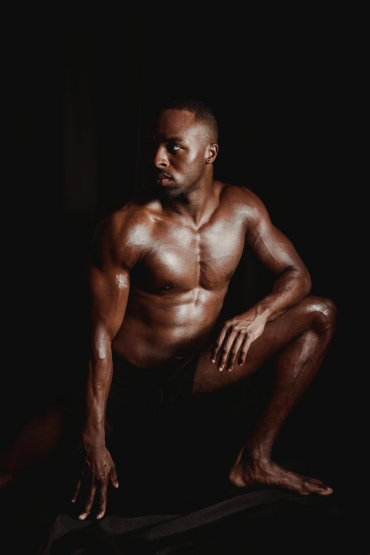 a man sitting on a skateboard in the dark, an album cover, by Jessie Alexandra Dick, bodybuilder body, fully chocolate, black main color, gif