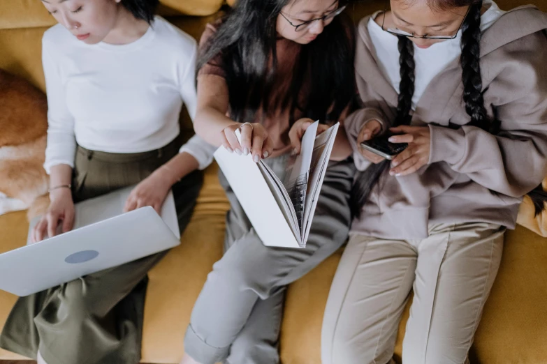 a couple of women sitting next to each other on a couch, a picture, trending on pexels, reading engineering book, group of people, white sketchbook style, avatar image