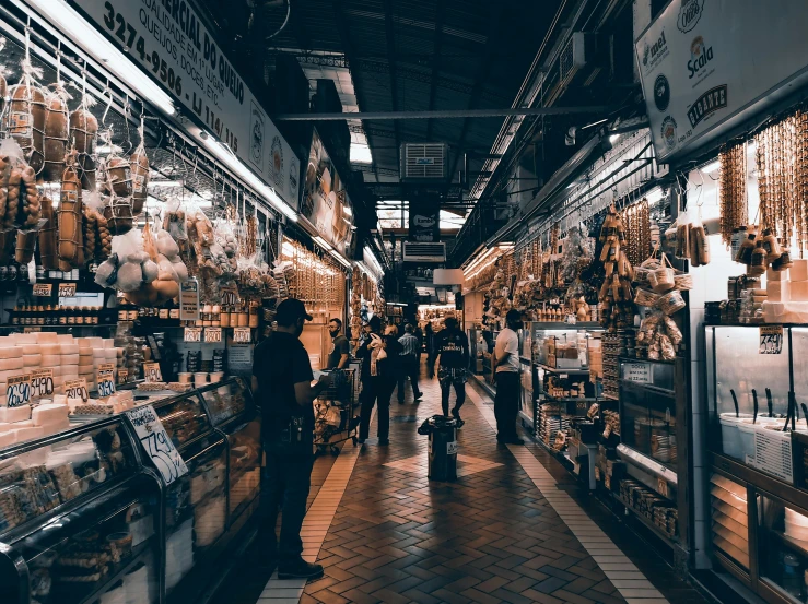 a store filled with lots of different types of food, by Julia Pishtar, pexels contest winner, maximalism, china town blade runner, walking to the right, 🦩🪐🐞👩🏻🦳, dark and beige atmosphere