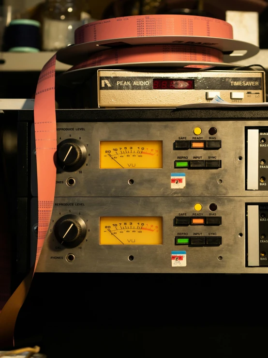 a pair of tape recorders sitting on top of a table, control panel, taken at golden hour, ayne haag, cinematic image