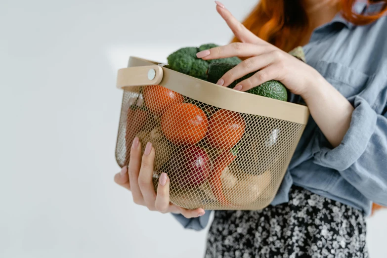 a woman holding a mesh bag filled with vegetables, pexels contest winner, bauhaus, beige, small, thumbnail, bowl